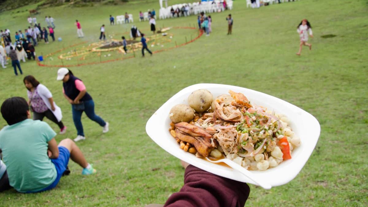 A plate of delicious hornado, Mushak Nina festival, Cochasquí, Ecuador | ©Angela Drake A plate of delicious hornado, Mushak Nina festival, Cochasquí, Ecuador | ©Angela Drake