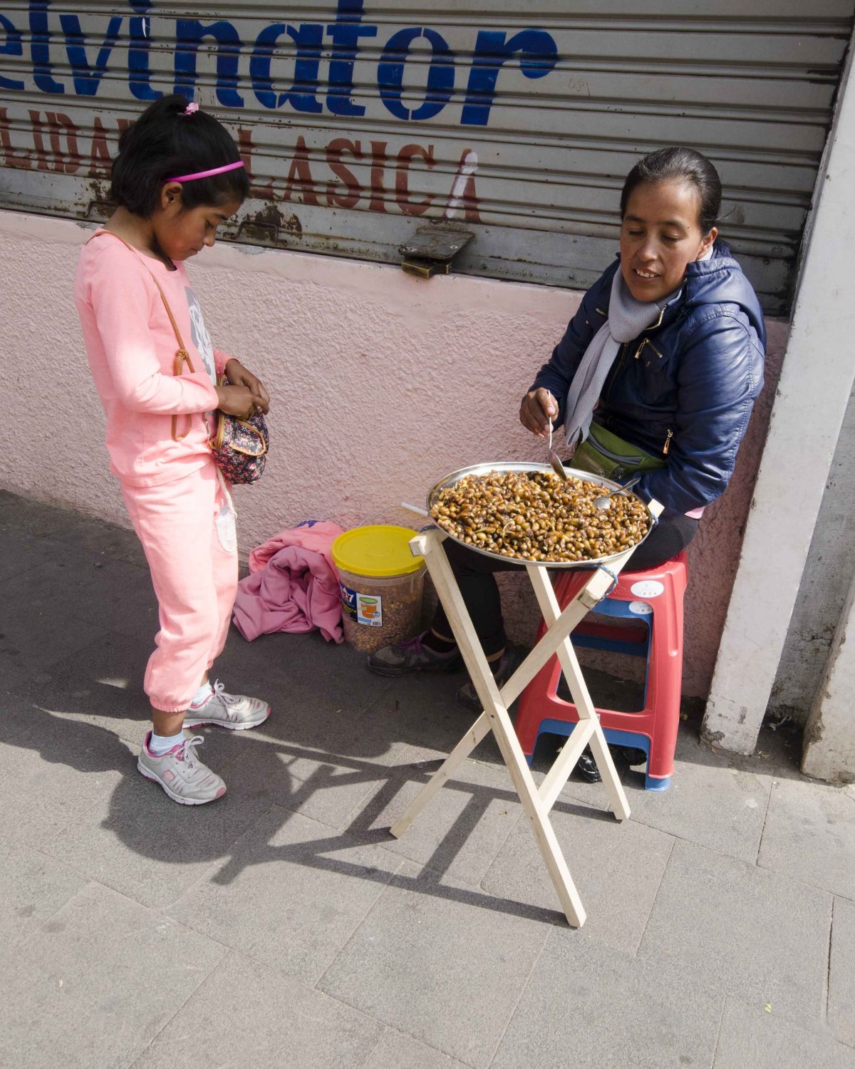 Catzos Vendor in Otavalo, Ecuador | ©Angela Drake Catzos Vendor in Otavalo, Ecuador | ©Angela Drake