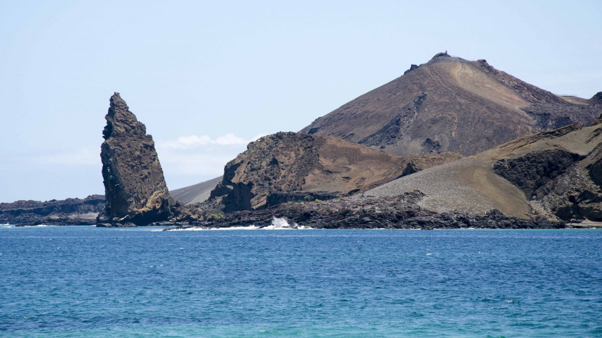Pinnacle Rock, heading towards Bartolome from Santiago Island, the Galapagos. Pinnacle Rock, heading towards Bartolome from Santiago Island, the Galapagos.