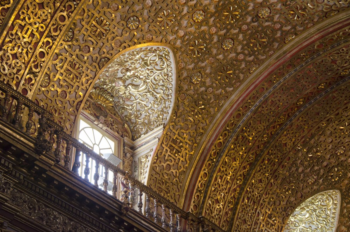 A small window in the higher reaches of the church allows light to reflect of the gold leaf ceiling