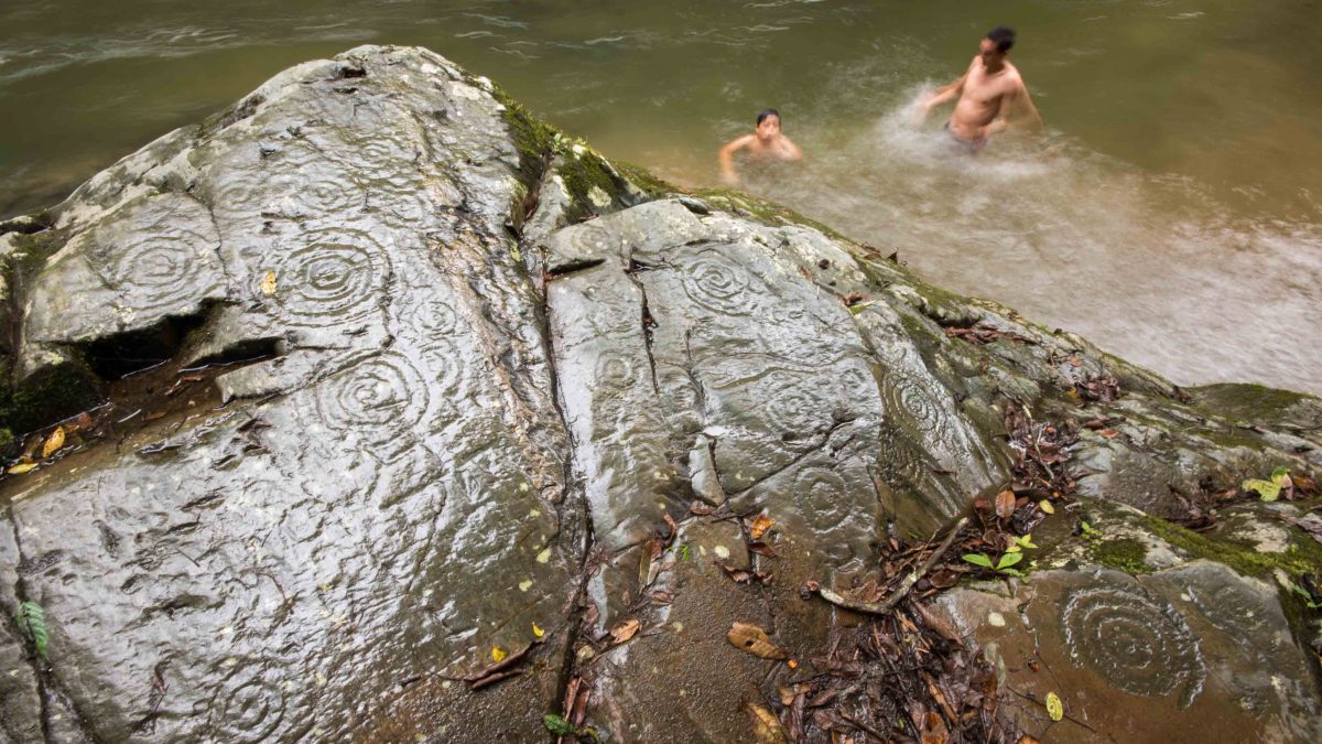 A rock full of petroglyphs, Rio Chirapi, Pacto, Ecuador A rock full of petroglyphs, Rio Chirapi, Pacto, Ecuador