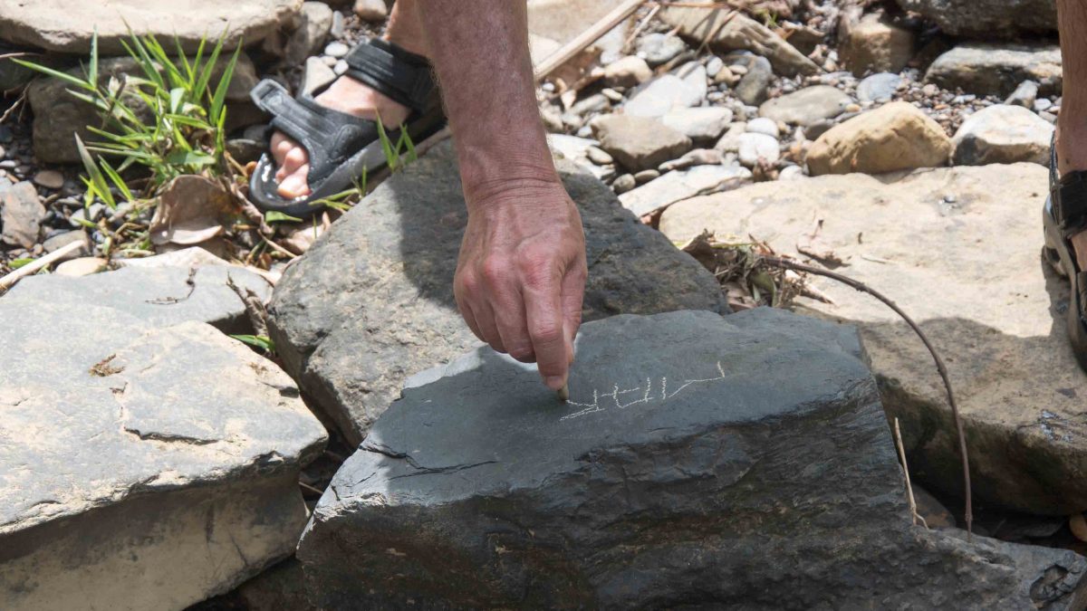 Using chalk found by the river, Cascadas Yanayacu, Napo Province, Ecuador Using chalk found by the river, Cascadas Yanayacu, Napo Province, Ecuador