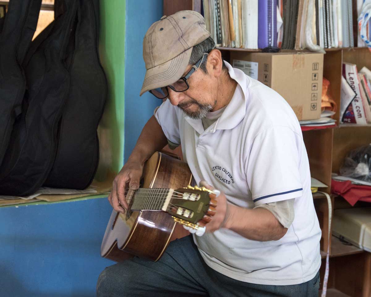 Trying to tune a guitar; San Bartolome, Ecuador | ©Angela Drake Trying to tune a guitar; San Bartolome, Ecuador | ©Angela Drake