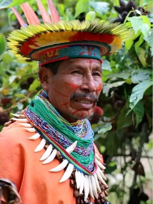 A Siona in feathered headdress and adorned with necklaces