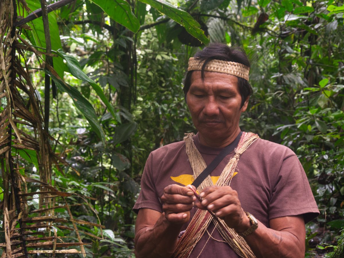 Bae, our Waorani guide in the Pastaza Province of Ecuador, demonstrates how to use a native plant.