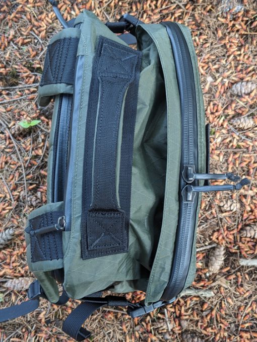 The GR3 backpack showing a flap folded back for easy access to the zipper.