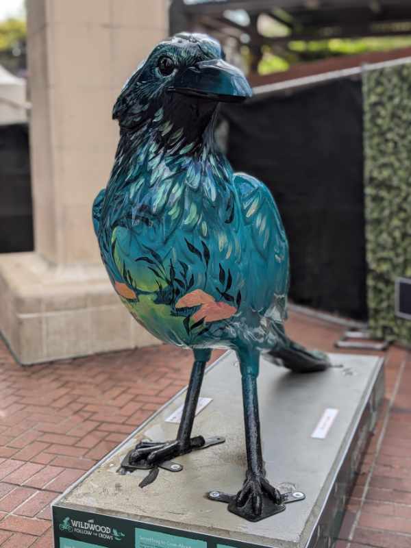Overgrowth, a crow sculpture along the Follow the Crows trail, taken from the front to show the intricate detail on its breast.